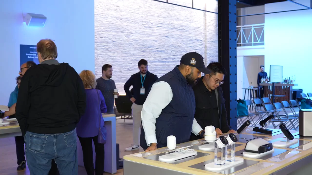 Attendees gathered around a product display at the eufy showcase.