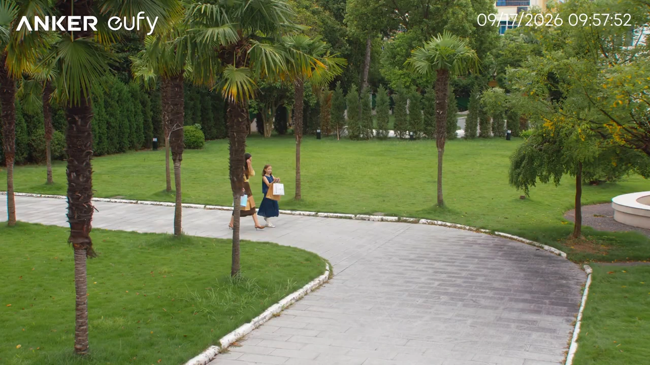 Wide camera view showing two people outdoors.