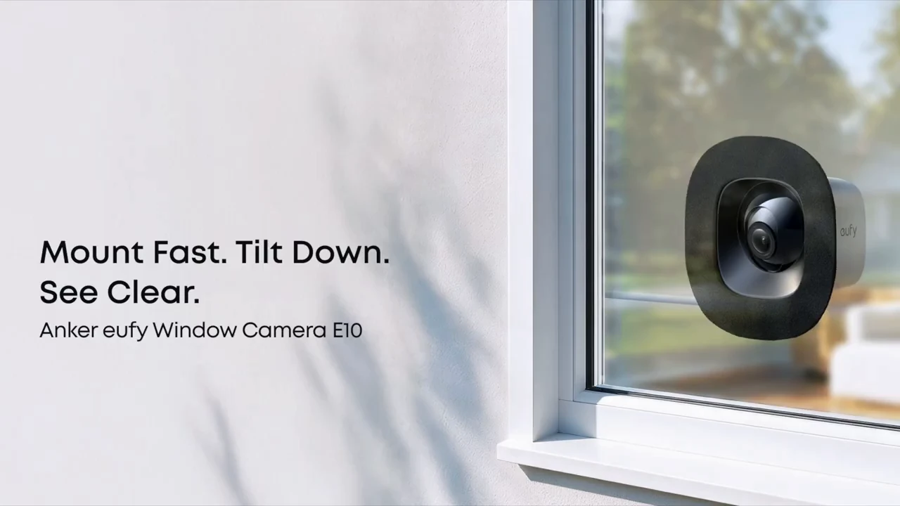 eufy Window Camera E10 mounted indoors against a window.