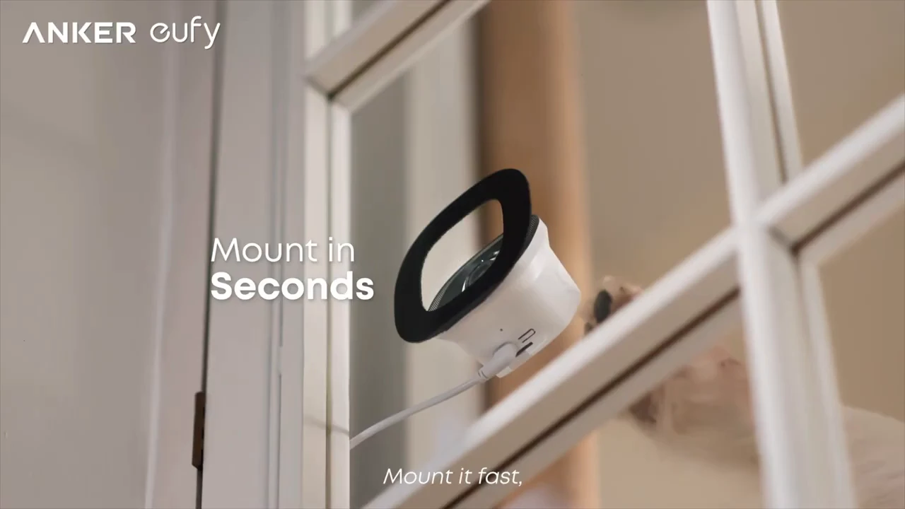 eufy Window Camera E10 positioned against a window in a product illustration.