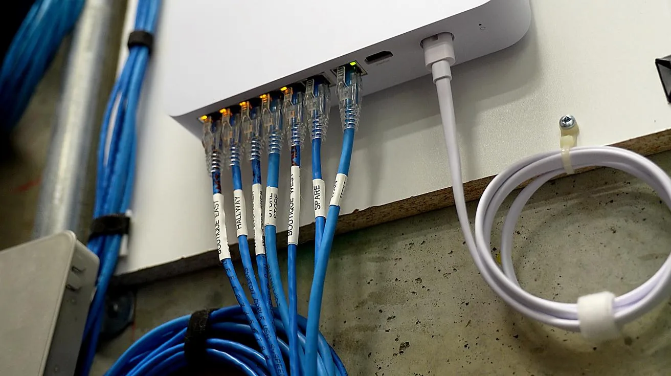 Labeled ethernet cables connected to NVR