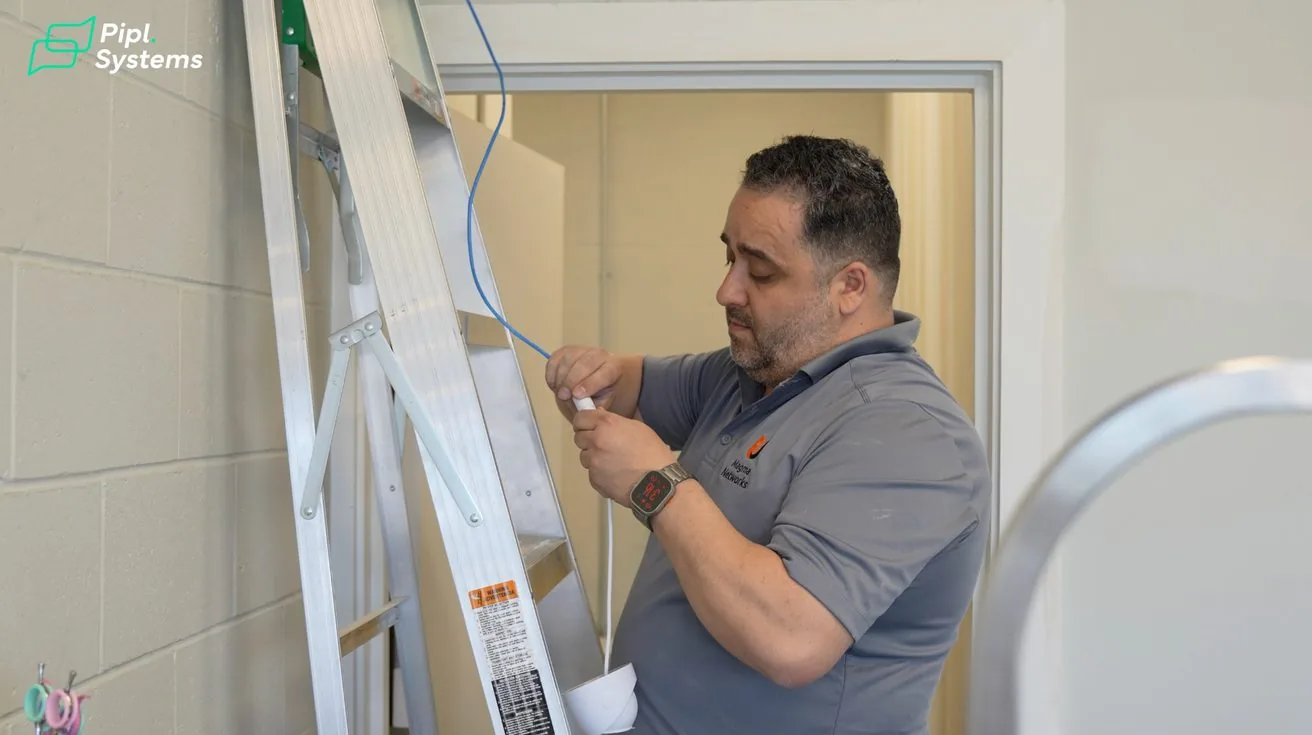 Technician installing security camera