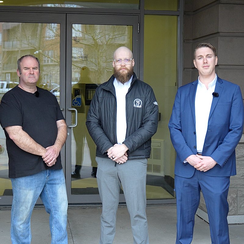 Team outside building entrance