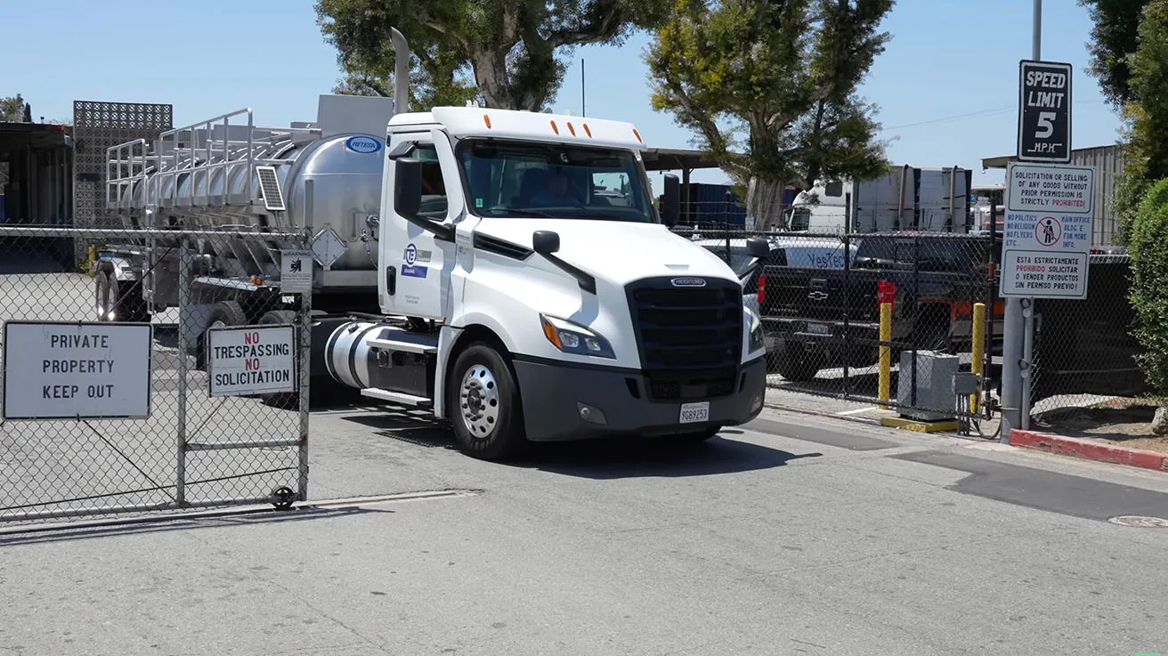 Commercial truck entering a logistics yard monitored by an automated UniFi video surveillance system