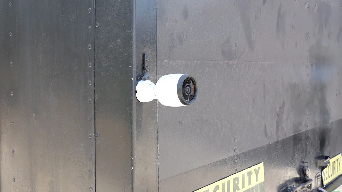 UniFi G6 Bullet security camera mounted on a metal container for localized yard surveillance