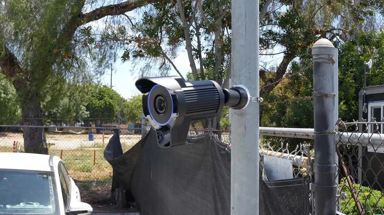 UniFi AI LPR camera installed on a perimeter fence for accurate vehicle and license plate tracking