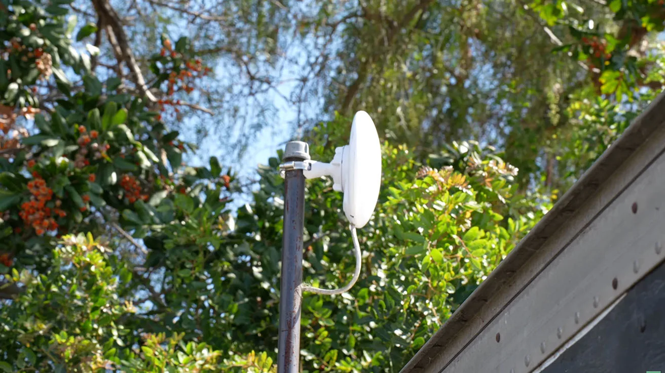 Ubiquiti wireless bridge establishing long-range network connectivity across a sprawling truck yard