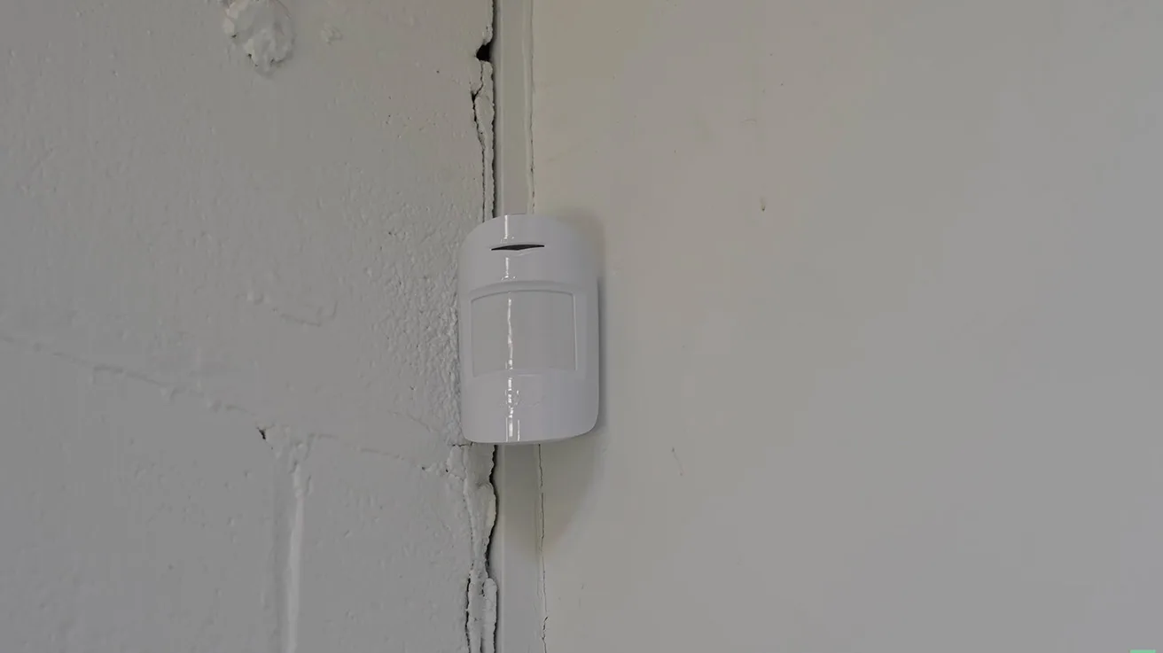 Wall-mounted Ajax MotionProtect PIR motion detector with pet immunity algorithms