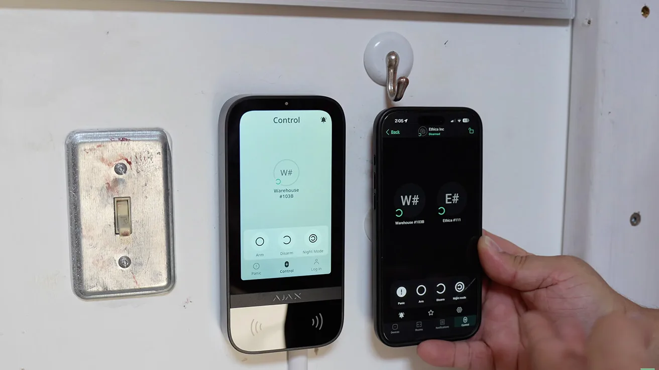 Wall-mounted Ajax KeyPad TouchScreen assigned specifically to warehouse access group