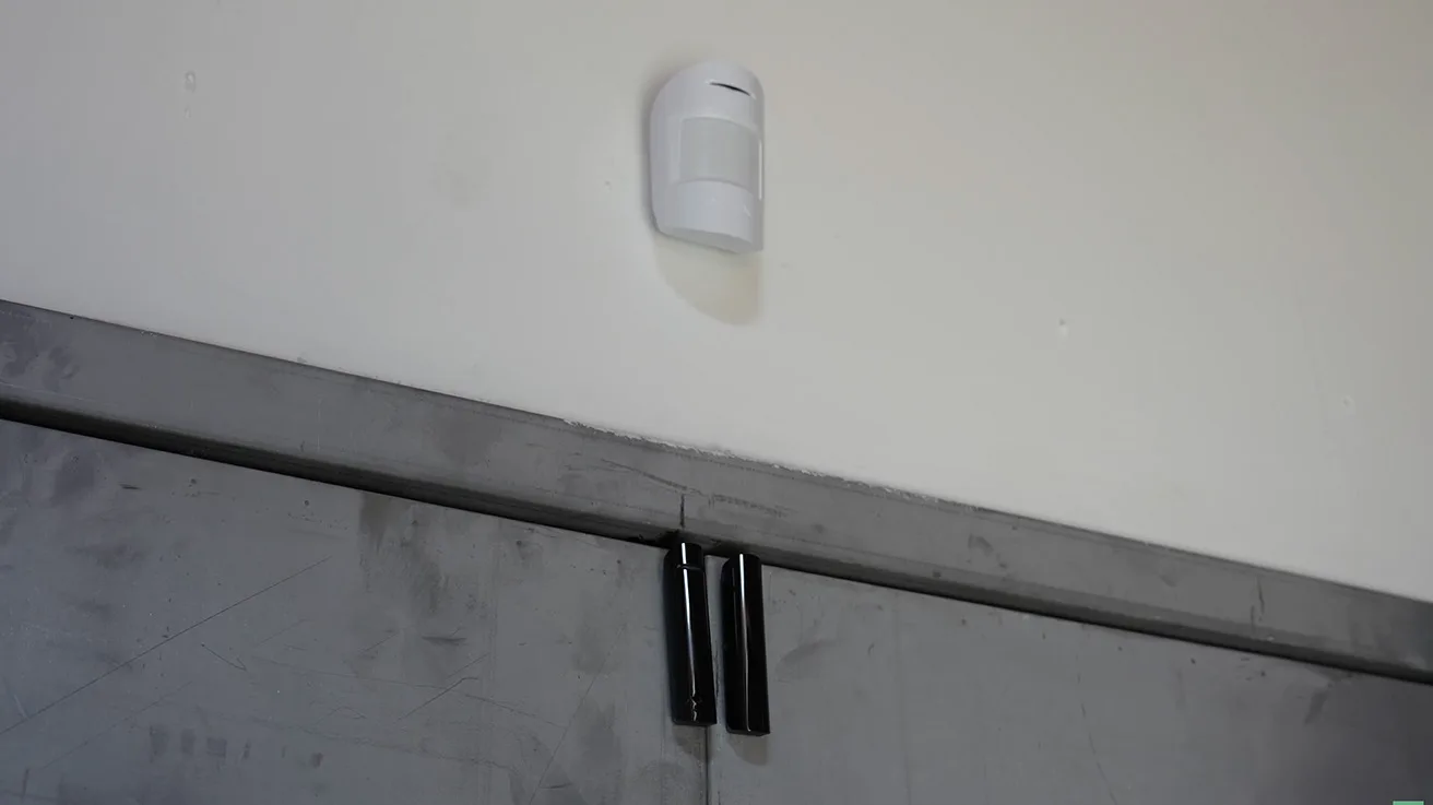 Ajax MotionProtect and DoorProtect sensors covering commercial warehouse interior
