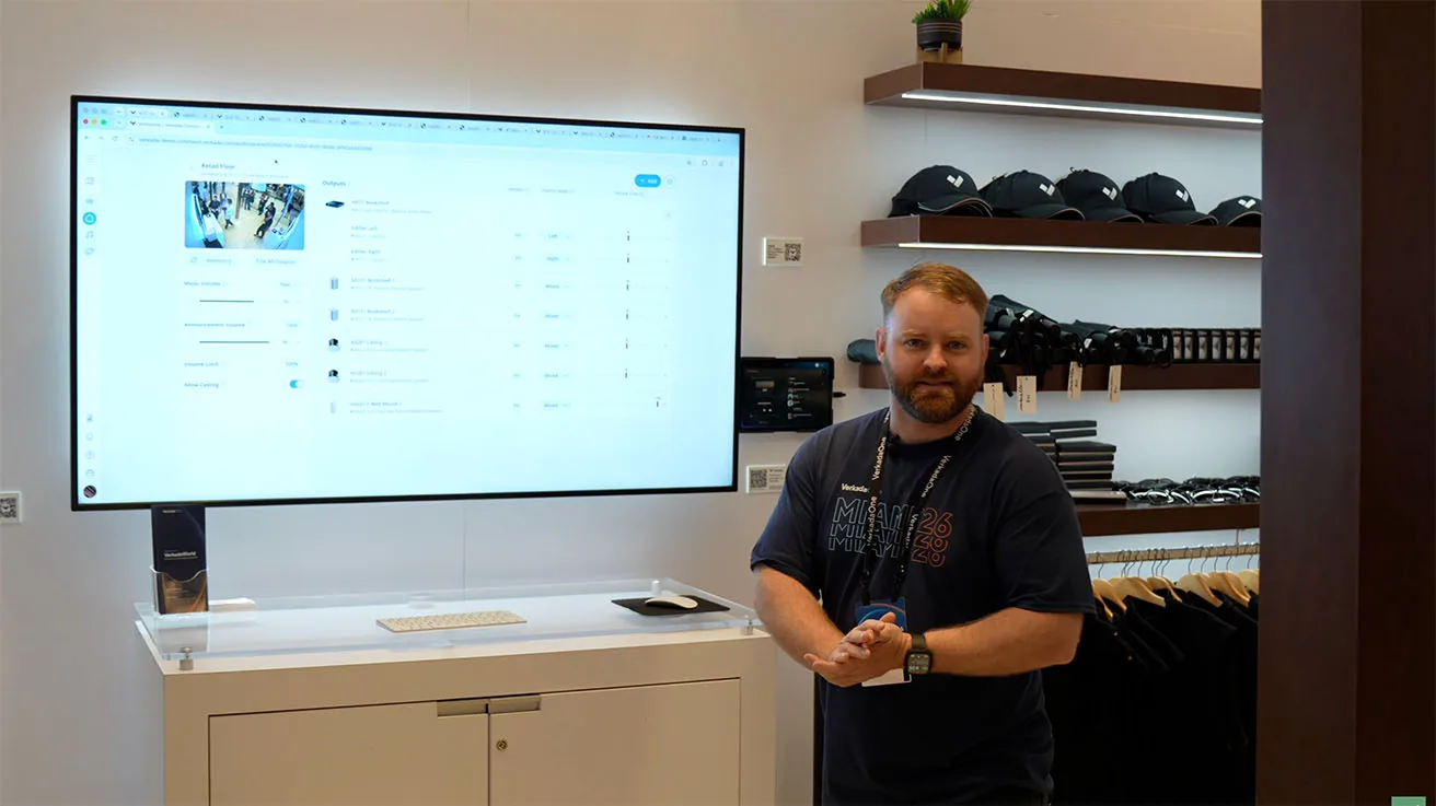 Verkada representative demonstrating the cloud-based audio management interface on a large display.
