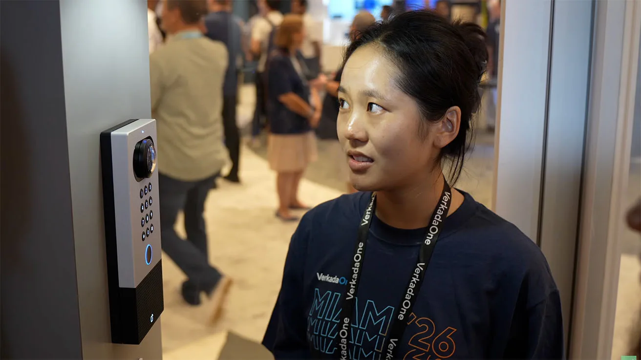 Delivery courier interacting with the Verkada TD63 Intercom AI Voice Directory for automated call routing to specific facility personnel.