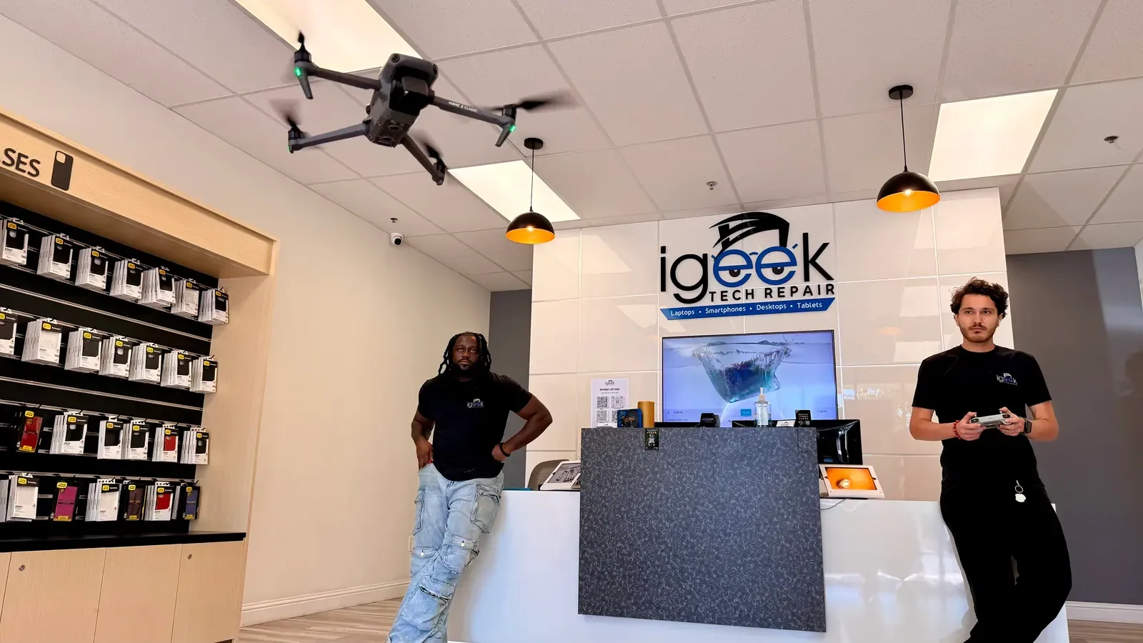 iGeek Tech Repair team at the front counter of its Elk Grove, California shop