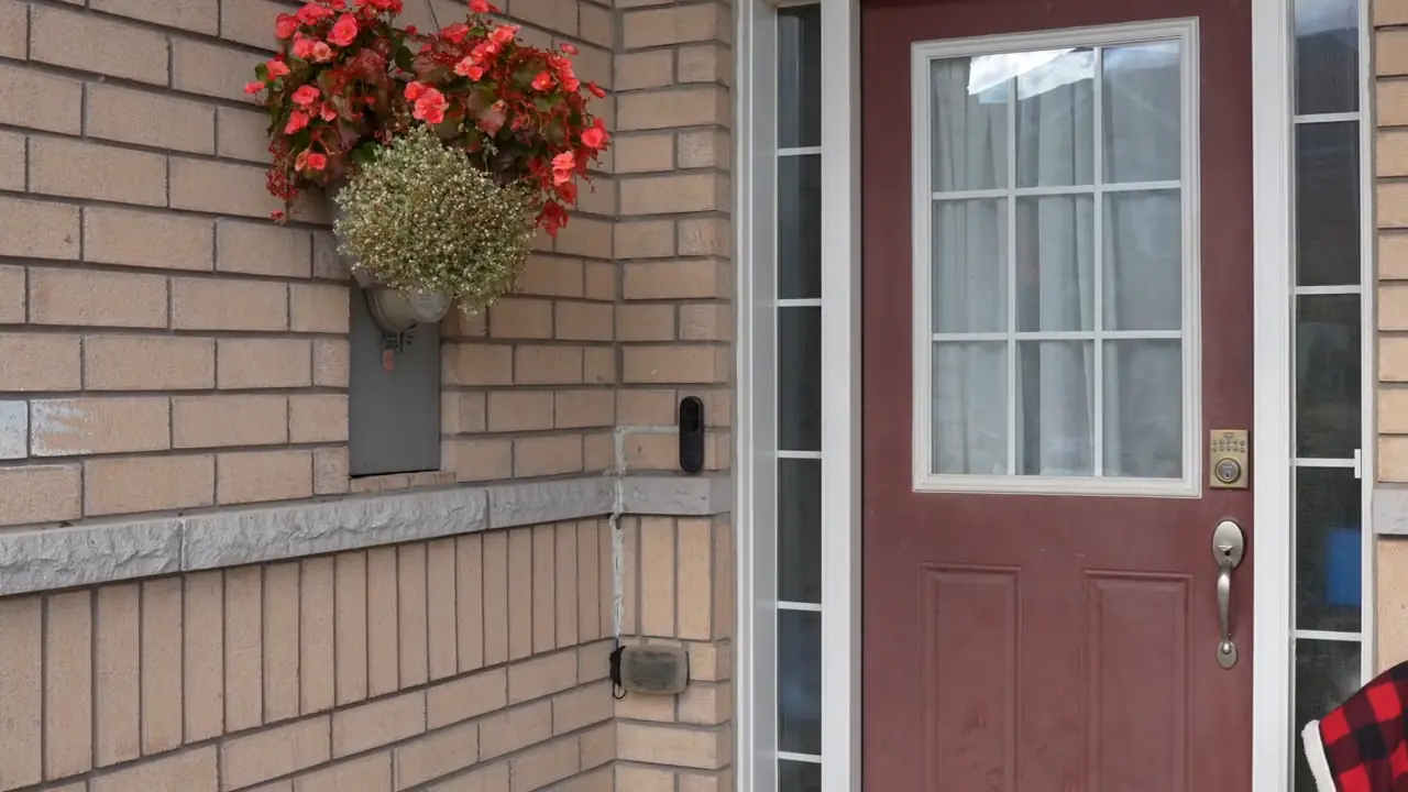 Existing Reolink camera beside the front entrance