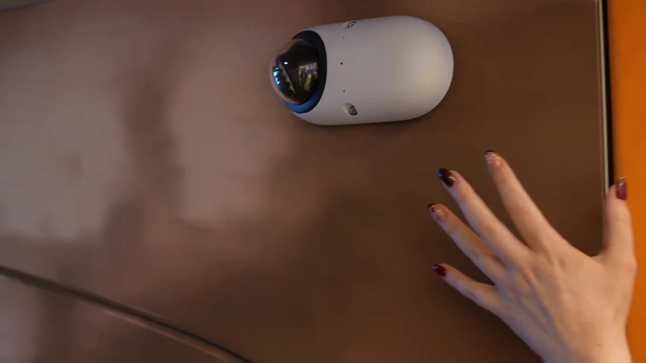 Compact white Verkada transportation camera mounted on a display panel.