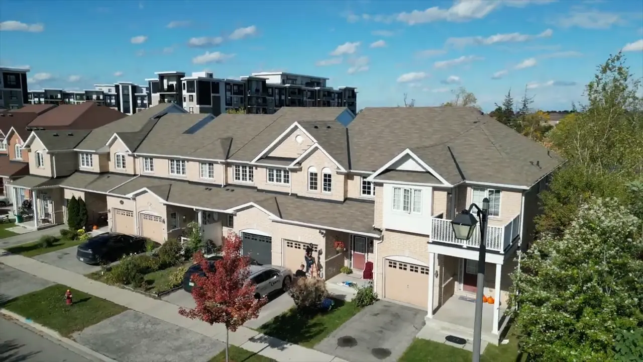 Aerial view of houses and driveways at the installation location